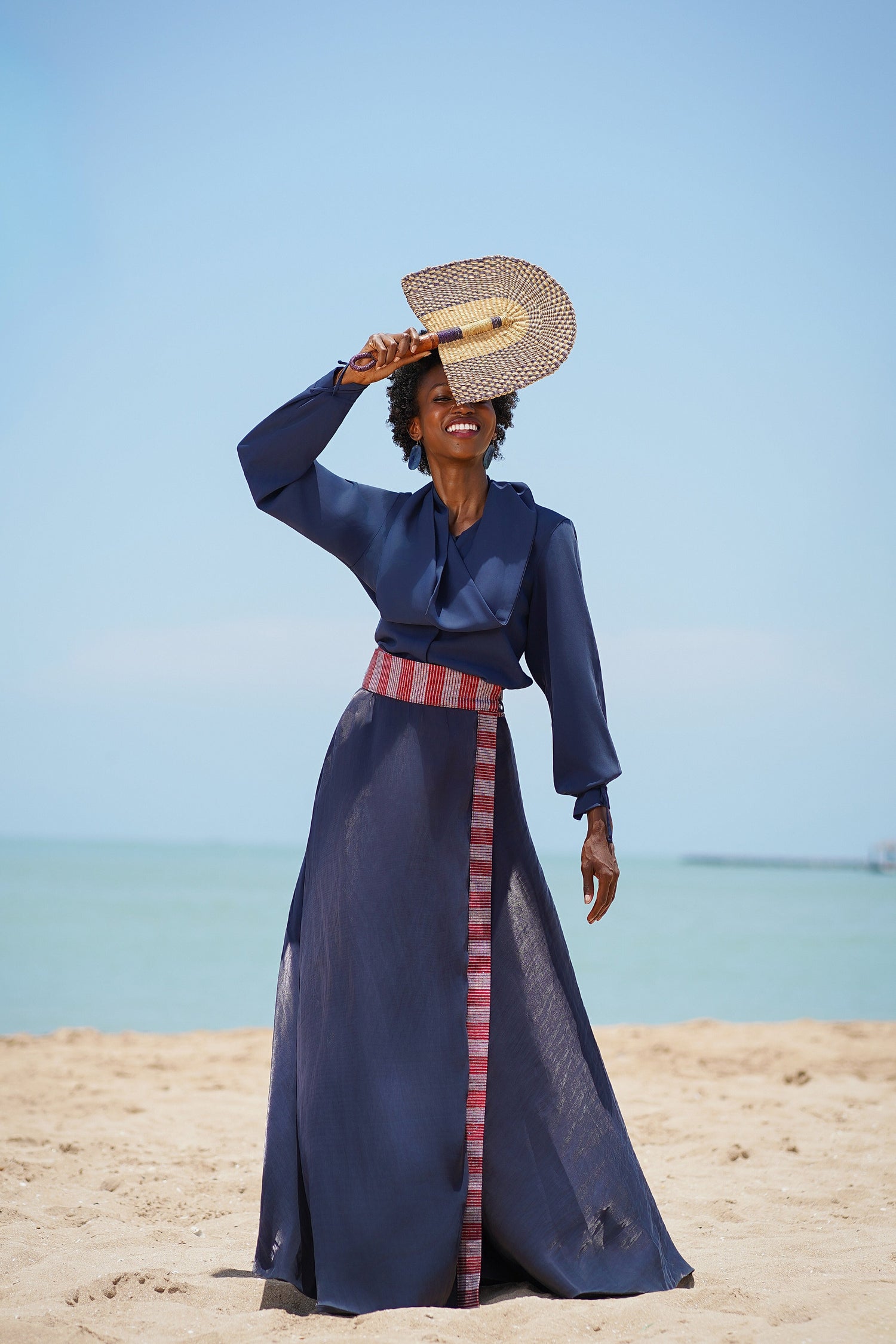 Huda blue wrap premium crepe and organza skirt with Pagne Tissé handwoven detail.